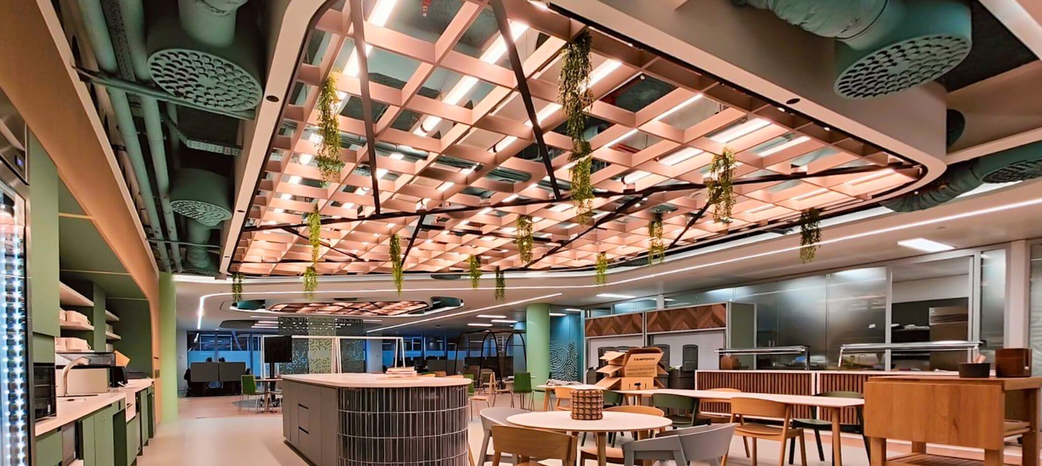 Acoustic grid ceiling installed at American Express to manage noise in the social kitchen
