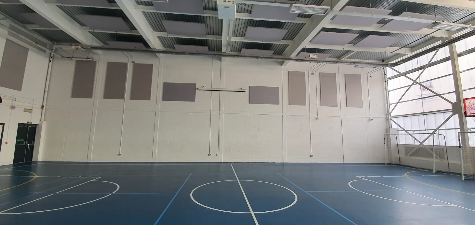 Youth club with acoustic rafts on the ceiling