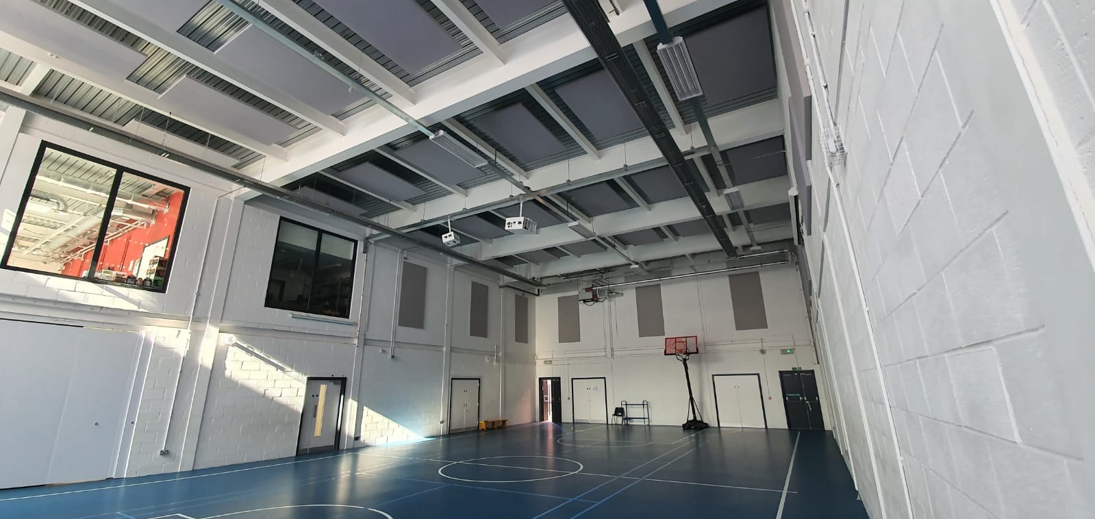 Youth club with acoustic rafts on the ceiling