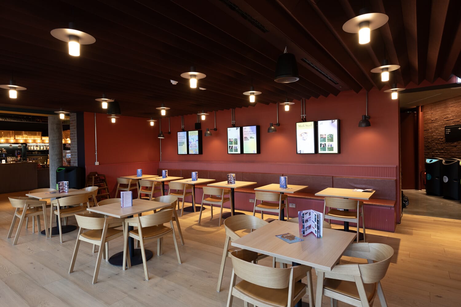 Dining area in Beam Hertford Theatre with an acoustic baffle ceiling