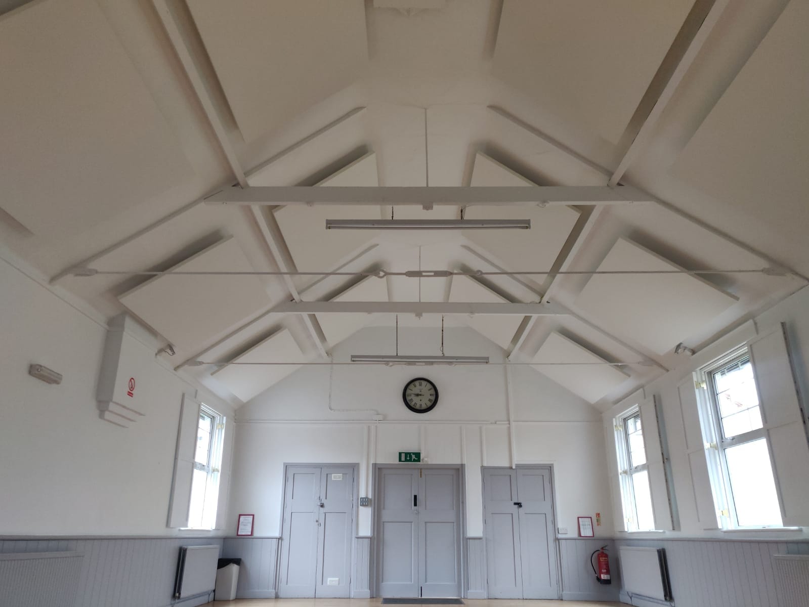 Village hall with acoustic panels on ceiling