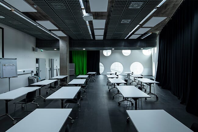 University classroom with acoustic rafts on the ceiling