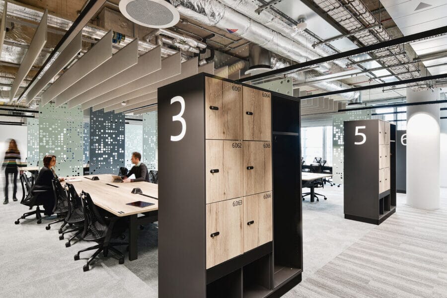 Open plan office with acoustic baffles and acoustic room dividers