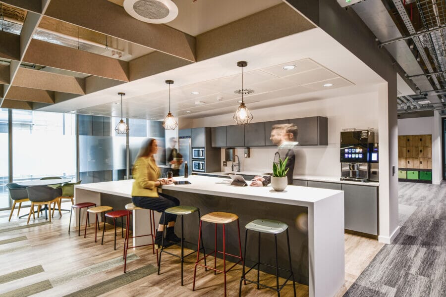 Office tea point with acoustic grid ceiling