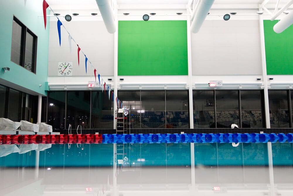 Swimming pool with acoustic panels on walls