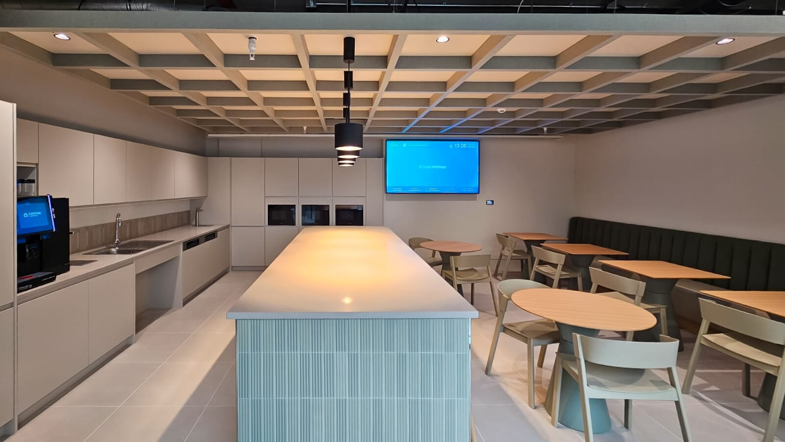 Open plan tea point with Acoufelt acoustic grid ceiling