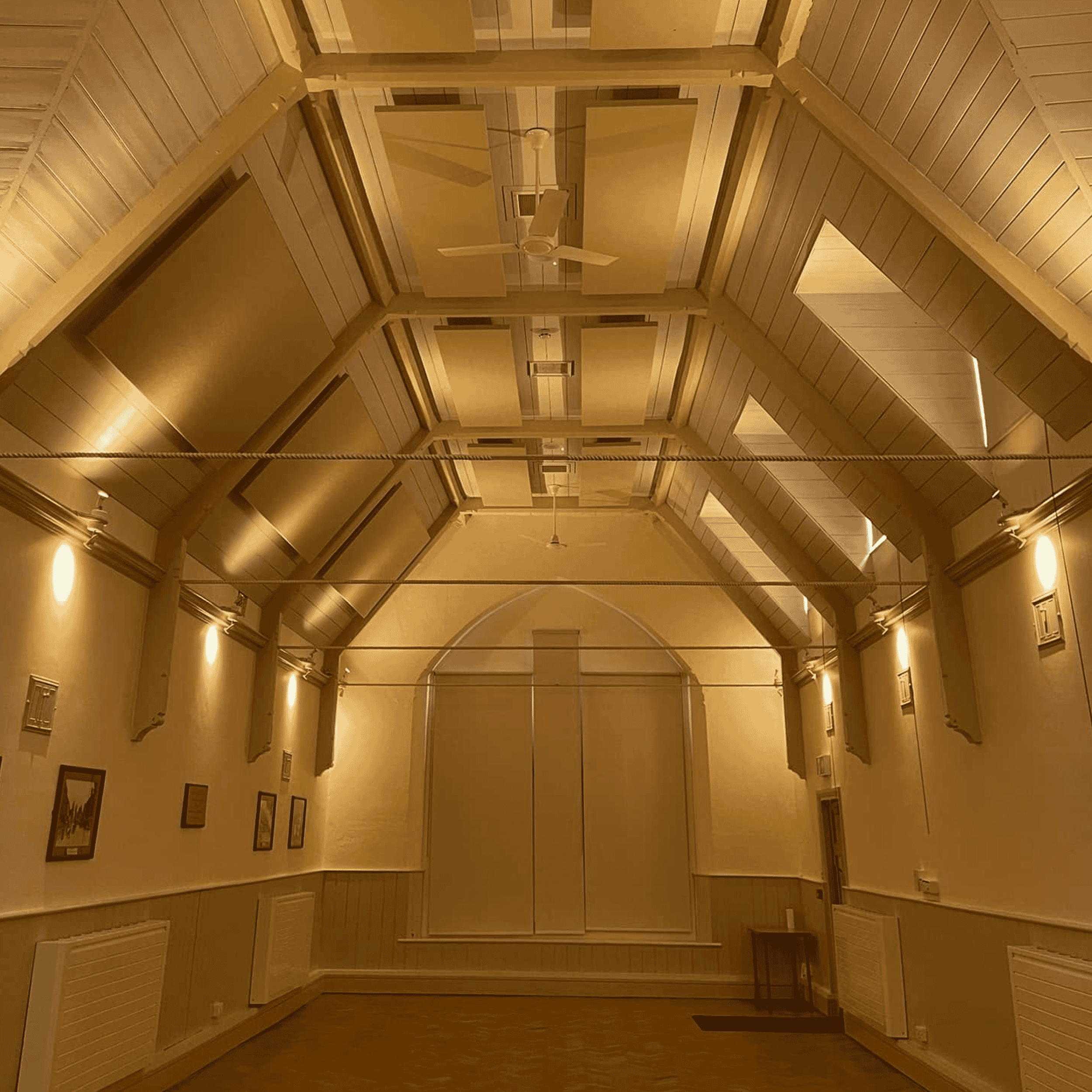 Acoustic panels were installed on the ceiling of Stagsden Village Hall, reducing echo and improving speech clarity.