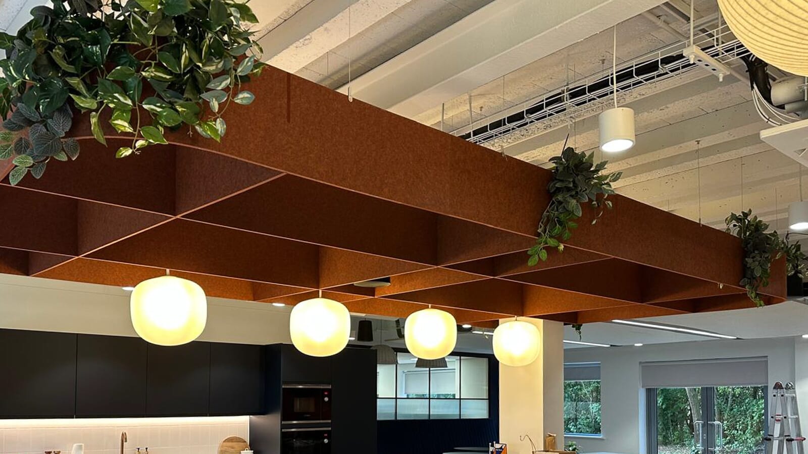 Custom acoustic ceiling installed in the Van Oord's office kitchen