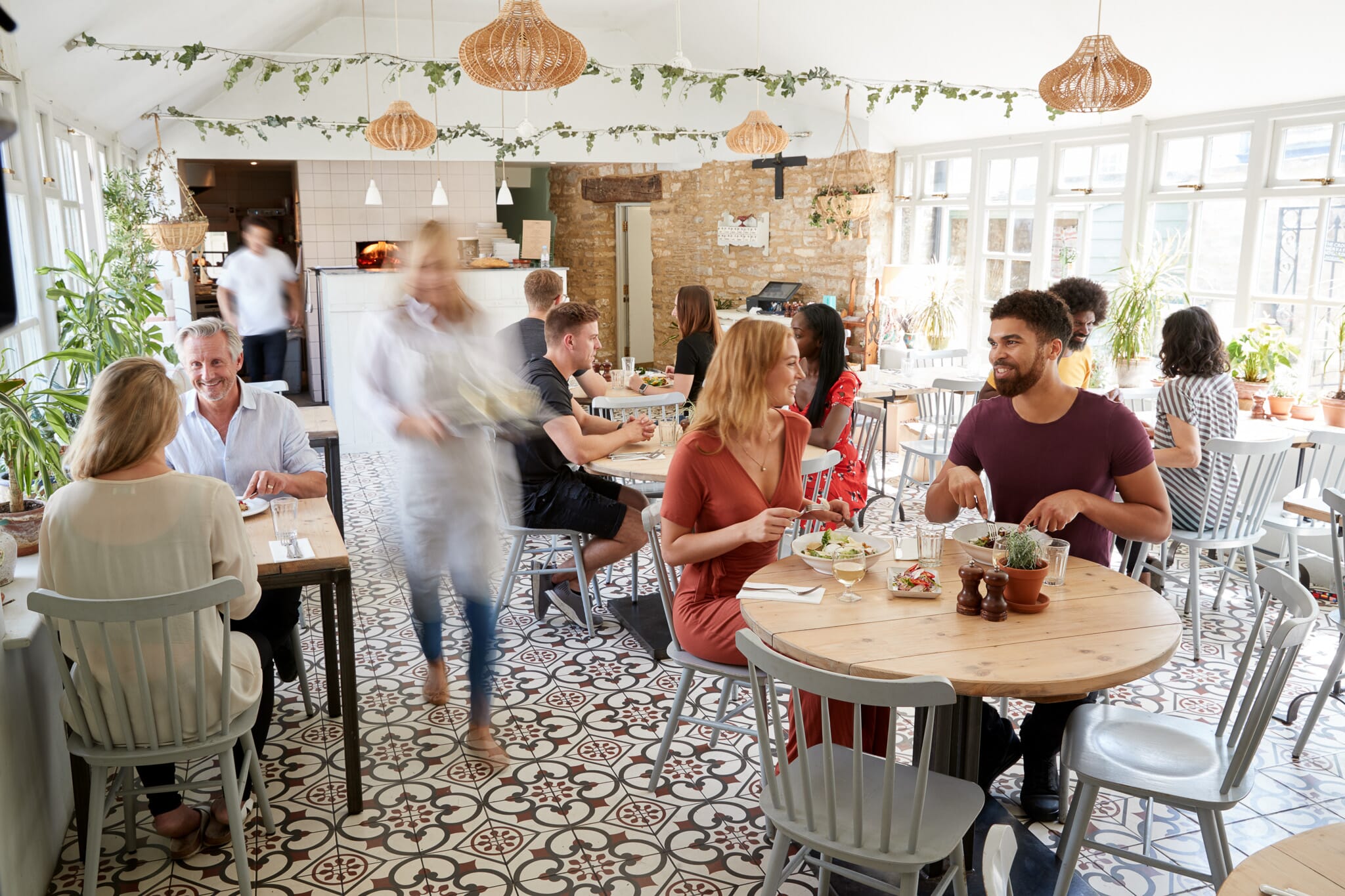 Customers eating at a busy cafe