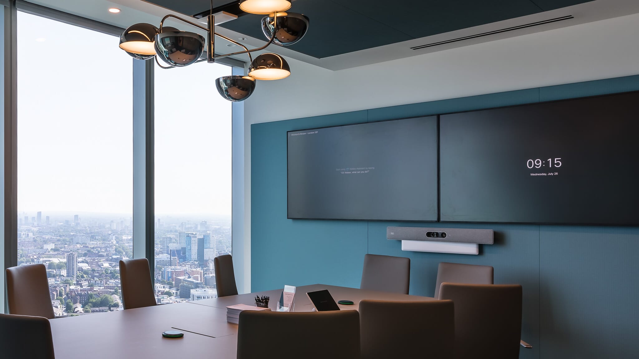 Tenso stretched fabric acoustic system installed in a meeting room to improve audio clarity and privacy.